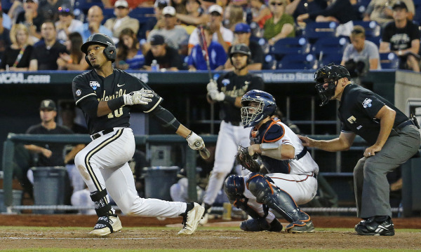 Photo of John Norwood hitting the go-ahead home run in game 3 of the College World Series final representing the 2014 season