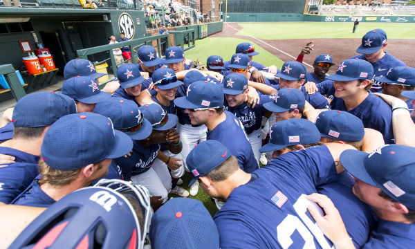 Photo of the Vanderbilt baseball team huddled in front of their dugout representing the 2017 season